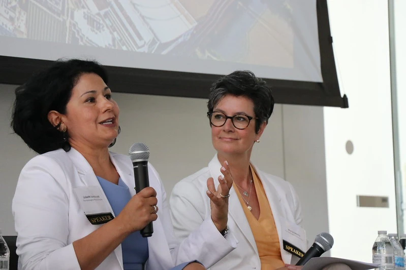 Women speaking on panel